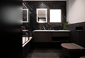 Las griferías de la serie Project-tres, en negro mate, de Tres Grifería aportan su toque de estilo e innovación tecnológica en estos dos baños diseñados por el estudio de interiorismo Sincro